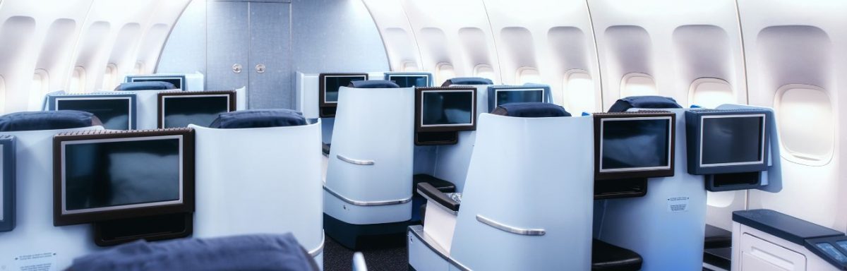 Am interior view of a business class cabin on a plane.