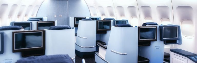 Am interior view of a business class cabin on a plane.