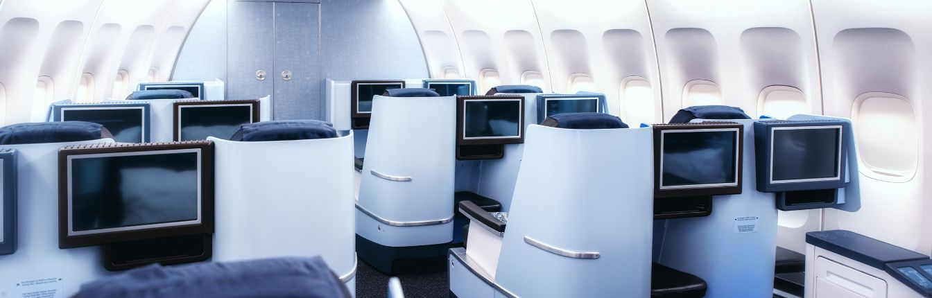 Am interior view of a business class cabin on a plane.