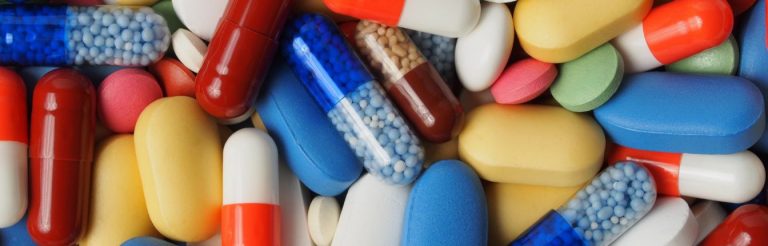 A variety of different colored pills.
