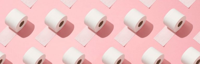 A digital image of rolls of toilet paper repeated on a pink background.