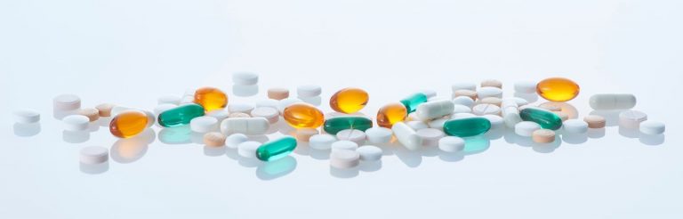A variety of white, blue and yellow pills